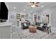 Entertaining living room with bar, cabinets, shelves, and large comfortable leather couch at 4084 Peachtree Dunwoody Ne Rd, Atlanta, GA 30342