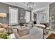 Sophisticated living room showcasing a blend of textures, stylish lighting, and comfortable seating options at 4084 Peachtree Dunwoody Ne Rd, Atlanta, GA 30342