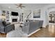 Inviting living room with a fireplace, built-in shelves, hardwood floors, and an open floor plan at 4084 Peachtree Dunwoody Ne Rd, Atlanta, GA 30342