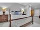 A view of the main bedroom with comfortable bed, matching dressers, lamps and stylish decor at 4084 Peachtree Dunwoody Ne Rd, Atlanta, GA 30342
