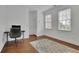 Cozy office featuring a rolling desk chair and a view from the two sunny windows at 4084 Peachtree Dunwoody Ne Rd, Atlanta, GA 30342