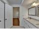 Bathroom with double vanity, granite countertops, and easy access to an additional room at 500 Allen'S Landing Ct, Lawrenceville, GA 30045