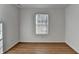 Bedroom featuring wood-look flooring and a window with natural light at 500 Allen'S Landing Ct, Lawrenceville, GA 30045