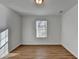 Bedroom featuring wood-look flooring and a window with natural light at 500 Allen'S Landing Ct, Lawrenceville, GA 30045