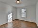 Bright bedroom with wood-look flooring and a window with natural light at 500 Allen'S Landing Ct, Lawrenceville, GA 30045
