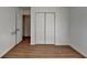 Bedroom with hardwood floors, and a double closet at 500 Allen'S Landing Ct, Lawrenceville, GA 30045