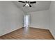 Bedroom with wood-look floors and an open door showcasing the home's layout at 500 Allen'S Landing Ct, Lawrenceville, GA 30045