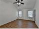 Well-lit bedroom with a ceiling fan, two windows, and neutral walls for a cozy atmosphere at 500 Allen'S Landing Ct, Lawrenceville, GA 30045
