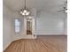 Well-lit dining room with views into the hallway and a modern chandelier at 500 Allen'S Landing Ct, Lawrenceville, GA 30045