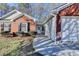 A close-up view of the front exterior, highlighting the walkway, door, and attached garage at 500 Allen'S Landing Ct, Lawrenceville, GA 30045