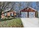 Charming brick home with an attached two-car garage and well-manicured front yard at 500 Allen'S Landing Ct, Lawrenceville, GA 30045