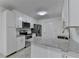 Modern kitchen featuring stainless steel appliances, white cabinetry, and granite countertops at 500 Allen'S Landing Ct, Lawrenceville, GA 30045