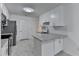 Modern kitchen with stainless steel appliances, white cabinets, and granite countertops at 500 Allen'S Landing Ct, Lawrenceville, GA 30045