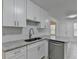Kitchen with granite countertops, stainless steel appliances and white cabinetry at 500 Allen'S Landing Ct, Lawrenceville, GA 30045