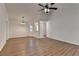 Open living room with ceiling fan, hardwood floors and lots of natural light at 500 Allen'S Landing Ct, Lawrenceville, GA 30045