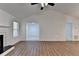 Spacious living room with hardwood floors and fireplace at 500 Allen'S Landing Ct, Lawrenceville, GA 30045