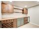 Basement bar area featuring a wooden countertop, wine rack, mini fridge and plenty of storage at 6641 Poplar Grove Way, Stone Mountain, GA 30087