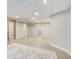 Open basement area with wood trim entryways and carpet flooring at 6641 Poplar Grove Way, Stone Mountain, GA 30087