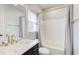 A modern bathroom with a shower and bathtub combination with a tiled shower surround at 6641 Poplar Grove Way, Stone Mountain, GA 30087