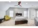 Bedroom with sloped ceilings, a ceiling fan, and carpet at 6641 Poplar Grove Way, Stone Mountain, GA 30087
