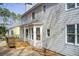 Back exterior view of home featuring deck, bay window and neutral siding at 6641 Poplar Grove Way, Stone Mountain, GA 30087
