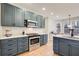 Modern kitchen featuring custom cabinets, stainless steel appliances, and ample counter space at 6641 Poplar Grove Way, Stone Mountain, GA 30087