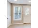 Neutral room with a window and a door with access to the exterior at 6641 Poplar Grove Way, Stone Mountain, GA 30087
