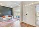 Inviting space with modern decor, large window, and stylish rug adjacent to the front door at 6641 Poplar Grove Way, Stone Mountain, GA 30087