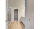 Bathroom features a glass shower, vinyl flooring, and a view into the walk-in closet at 129 Belvedere Rd, Mcdonough, GA 30253