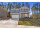 Charming brick two-story home with a two-car garage and manicured front lawn at 129 Belvedere Rd, Mcdonough, GA 30253