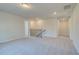 Hallway with neutral carpet, natural wood railing, and recessed lighting leads to other rooms in the home at 129 Belvedere Rd, Mcdonough, GA 30253