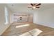 Bright open-concept living area, blending kitchen with white cabinets and a modern fireplace at 129 Belvedere Rd, Mcdonough, GA 30253