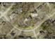 Aerial view highlighting the property's lot lines, providing a clear perspective of the home's placement and surroundings at 135 Cowan Trl, Stockbridge, GA 30281