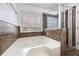 Bathroom featuring a soaking tub with jets and a glass enclosed shower at 135 Cowan Trl, Stockbridge, GA 30281