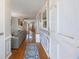 Inviting entryway featuring hardwood floors, neutral walls, and a view into the home's open-concept living space at 135 Cowan Trl, Stockbridge, GA 30281