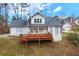 Charming home featuring a cozy front porch and a well-maintained exterior in a tranquil neighborhood setting at 135 Cowan Trl, Stockbridge, GA 30281