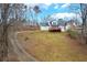 Lovely home nestled on a spacious lot with a winding driveway, offering privacy and curb appeal at 135 Cowan Trl, Stockbridge, GA 30281