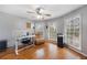 Bright home office featuring hardwood floors, windows with natural light, a ceiling fan, and office furnishings at 135 Cowan Trl, Stockbridge, GA 30281