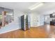 Bright open concept kitchen with stainless steel fridge and hardwood floors at 135 Cowan Trl, Stockbridge, GA 30281