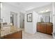 Bright bathroom featuring dual sinks, granite counters, and glass-enclosed shower at 771 Park Manor Se Dr, Smyrna, GA 30082