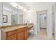 Bright bathroom features a granite countertop vanity, tiled floors, glass shower and access to a custom closet at 771 Park Manor Se Dr, Smyrna, GA 30082