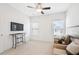 Cozy bedroom space featuring a ceiling fan, neutral walls, and plenty of natural light at 771 Park Manor Se Dr, Smyrna, GA 30082