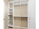 Custom closet with white shelving and drawers with wire storage baskets to maximize storage space at 771 Park Manor Se Dr, Smyrna, GA 30082