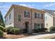 Traditional two-story brick home with symmetrical windows, shutters, and manicured landscaping at 771 Park Manor Se Dr, Smyrna, GA 30082