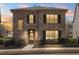 Evening view of a two-story brick home with black shutters and manicured landscaping at 771 Park Manor Se Dr, Smyrna, GA 30082