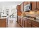 Gourmet kitchen with granite counters, stainless steel appliances, and an open view into the dining area at 771 Park Manor Se Dr, Smyrna, GA 30082