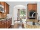 Modern kitchen showcasing granite countertops, stainless steel appliances, and a clear view into the dining area at 771 Park Manor Se Dr, Smyrna, GA 30082
