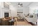 Cozy living room with a fireplace, stylish furniture, and an inviting seating arrangement at 771 Park Manor Se Dr, Smyrna, GA 30082