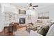 Inviting living room with a fireplace, built in shelves and lots of natural light at 771 Park Manor Se Dr, Smyrna, GA 30082