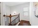 Staircase with wood treads, black metal balusters, and white risers leading to the upper level at 771 Park Manor Se Dr, Smyrna, GA 30082